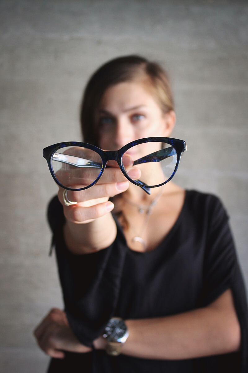 Woman Showing Glasses